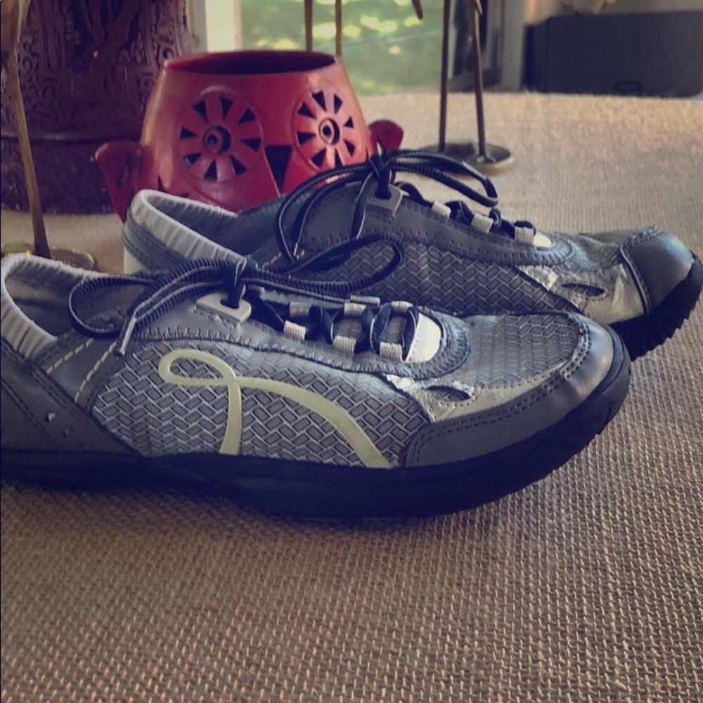 Gray sneakers by earth